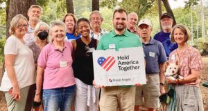 Group Photo with Hold America Together Sign