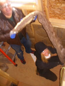 William Ellis and Shelli Yoder work on building a house together.