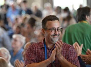 Convention man clapping